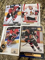Front view of four Daniel Alfredsson hockey cards laid out