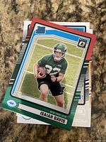 Top view of stack of Rated Rookie football cards, Isaiah Davis card visible
