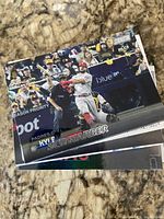 Stack of assorted baseball cards with Topps Stadium Club Kyle Schwarber on top