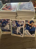 Stacks of 1991 Upper Deck baseball cards with three Blue Jays cards visible including Roberto Alomar