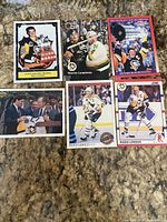 All six Mario Lemieux trading cards arranged on carpet