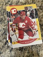 Stack of Pro Set hockey trading cards with Brad McCrimmon card on top
