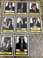 Eight Score 1991 Award Winner hockey cards laid out in binder sheet, visible fronts with trophy titles and player images
