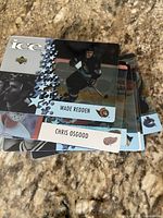 Stack of nine McDonald’s ICE hockey cards, Wade Redden card on top, Chris Osgood card partially visible