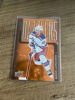 Front view of the Alexis Lafreniere Upper Deck Dazzlers hockey card in sleeve
