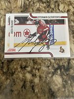 Front view of autographed Nick Foligno Score hockey card