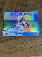 Front of holographic Upper Deck Slaps Leon Draisaitl trading card