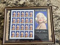 Framed sheet containing twenty Marilyn Monroe 32¢ stamps with adjacent portrait panel