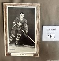 Front of Brit Selby Beehive Group 3 photo showing player image and faux wood border