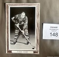 Front of Beehive Group 3 Elmer Vasko cardboard photo showing image, border and caption