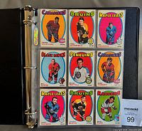 Nine base player cards in binder page, showing typical card design and condition