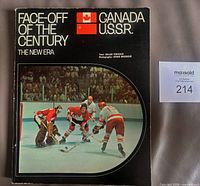 Front cover showing title, flags, and hockey action photo