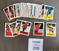 All 80 stickers front view with two rows of highlighted stars and MaxSold lot tag