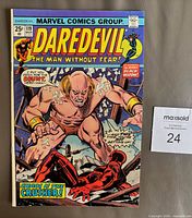 Front cover showing title, issue number 119, 25¢ price, main artwork, bagged