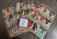 Stack of binder pages showing assorted 1977-78 OPC hockey cards