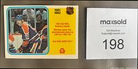 Front of 1982-83 OPC Wayne Gretzky Assist Leader card #240 with MaxSold lot number