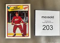 Front of Bob Probert rookie card alongside lot tag