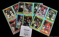 Fronts of four overlapped panels showing card images of Bourque, Mogilny, Lemieux, Gretzky, Roy, etc.