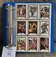 binder open showing first nine cards of set in plastic sheet