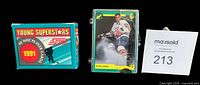 Front view showing Score Young Superstars box, Classic plastic case with Eric Lindros card, lot tag