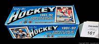 Closed blue O-Pee-Chee 1991-92 Hockey complete card set box front and side views