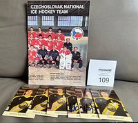 Front cover of program with five autographed mini calendars