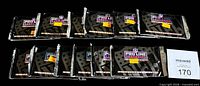 All 12 sealed Pro Line Portrait Signet Series packs laid out