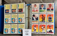 Binder open showing multiple pages of Score 1991 cards fronts and backs