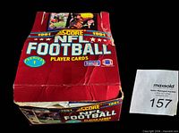Closed wax box exterior with branding and wear visible