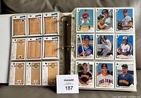 Open binder showing multiple pages of 1991 Upper Deck cards front and back