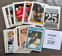Entire stack of cards fanned out showing anniversary header card and Gretzky card