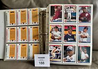 Open binder showing card backs and a full nine-card page of 1992 Upper Deck cards