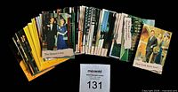 Fan-shaped spread of the bulk lot displaying volume and card backs/fronts