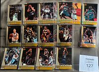 Sheet showing 15 Atomic Refractor rookie cards in album page