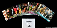 Fan spread of full 81-card set showing assorted fronts