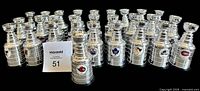 Front view of entire 28-cup set with team logos visible on several cups