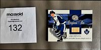 Front of Darryl Sittler Fleer card showing player image, stick insert and logo