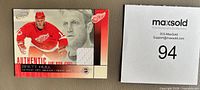 Front of 2002-03 Pacific Atomic Brett Hull jersey patch card showing photo, jersey swatch, and card details