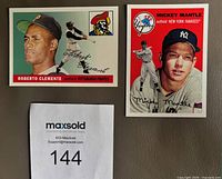 Front view of both cards showing Roberto Clemente and Mickey Mantle portraits