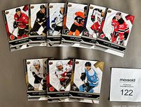 Front view of nine of the cards showing player images and Upper Deck logo