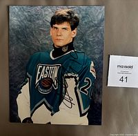 Front view of signed 8x10 color photo showing entire image and signature