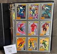 Fronts of nine cards in binder page showing characters like Blue Beetle and Flash