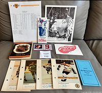 Group shot of roster sheet, action photo, bookmarks, postcard, player pages, guidebook