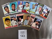 Front view of all 13 cards showing player names and teams