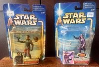 Front view of both unopened figures showing characters and packaging