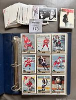 Binder open showing Classic Draft Picks cards, loose stack of Original Six cards, boxed Arena Draft Picks set