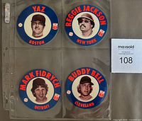 Front view of four discs in sleeve showing player portraits