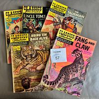 All five comics fanned out showing covers