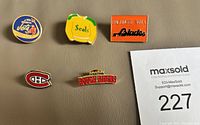Front view of all five enamel sports lapel pins