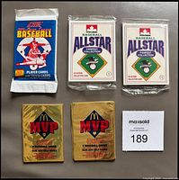 Front view of five unopened baseball card packs
